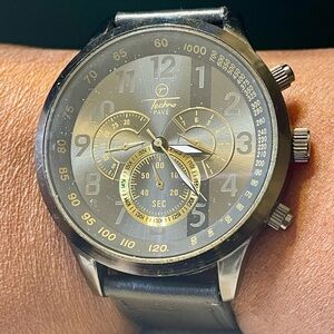 Black and Gold Quartz Stainless Steel  Watch with Faux Leather Band. Working.